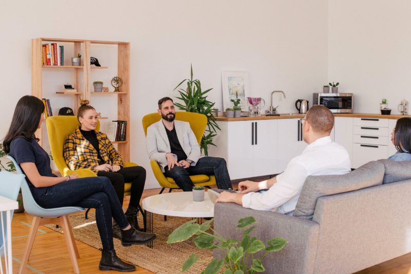 professionals sitting in co living accommodation